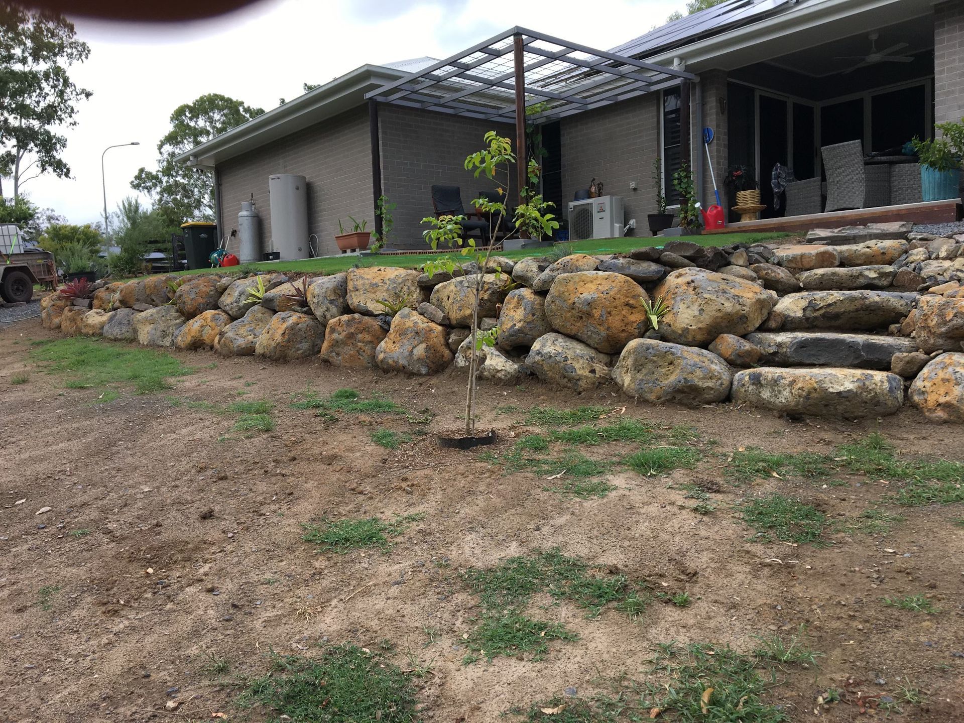 Stone Retaining Wall and Steps in Front of A House — A1 Rock This City Truck & Dog Hire In Good Night, QLD