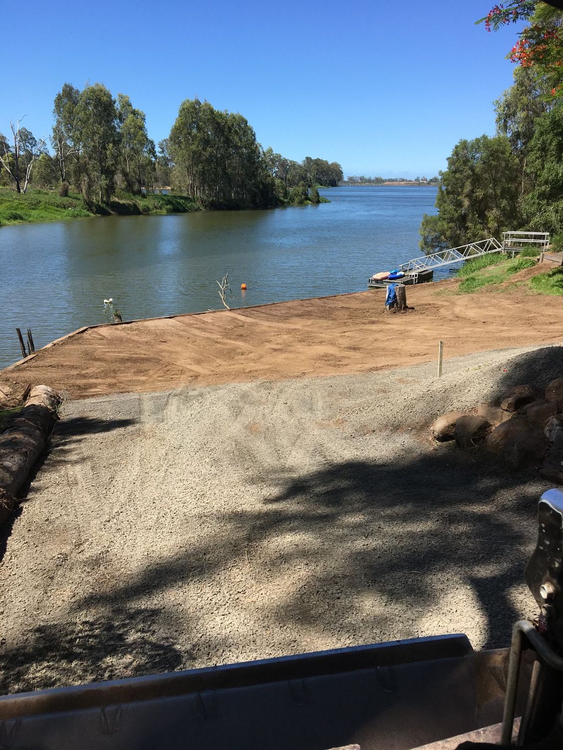 Riverfront Scene with Gravel Path, Water, Trees — A1 Rock This City Truck & Dog Hire In Good Night, QLD