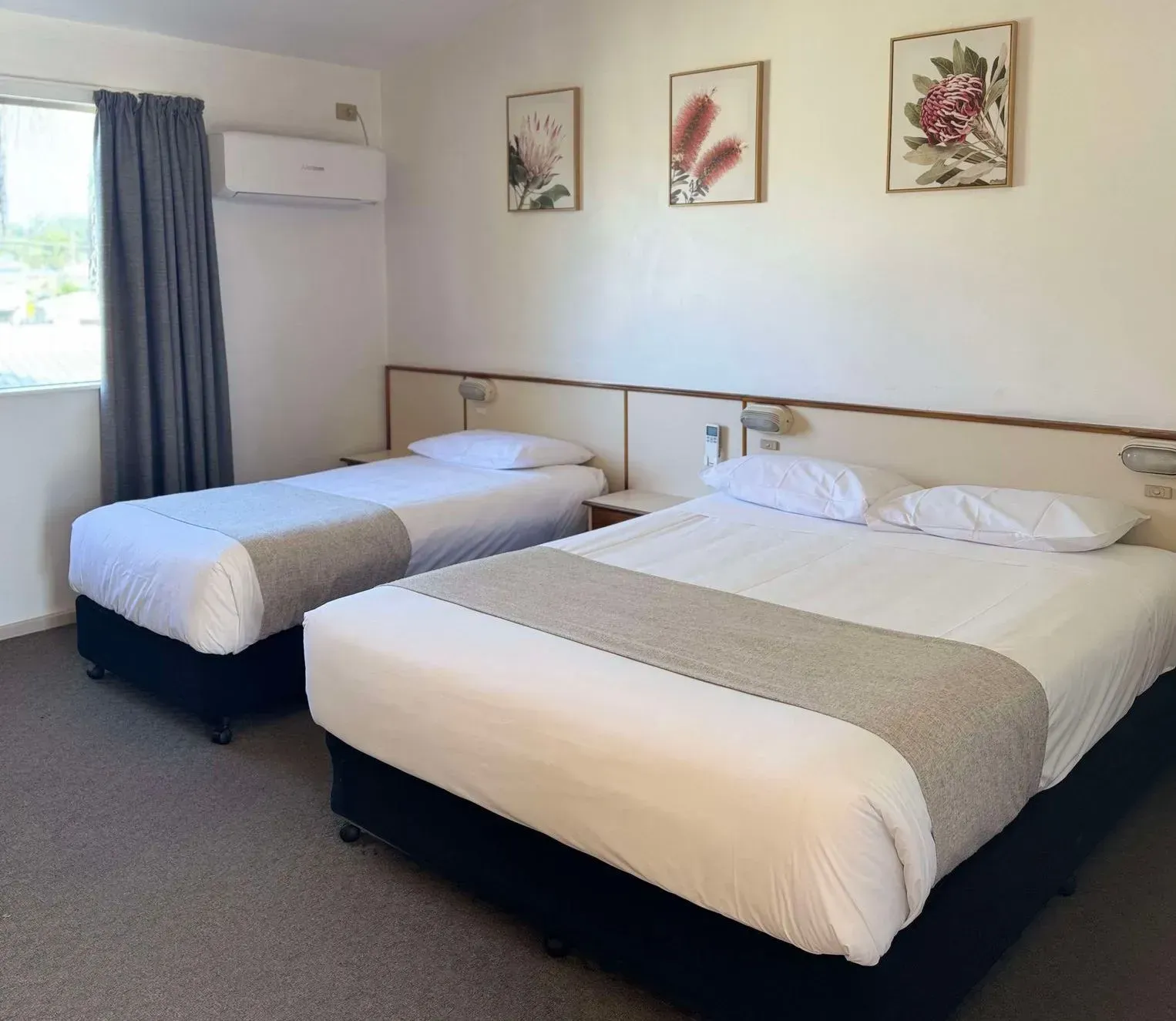 A Hotel Room With Two Beds and a Window — Country Comfort Gin Gin Wild Scotsman Motor Inn in Gin Gin, QLD