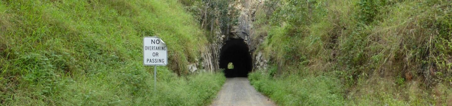 A Blurred Image of a Tunnel With a Sign on the Side of It — Country Comfort Gin Gin Wild Scotsman Motor Inn in Gin Gin, QLD