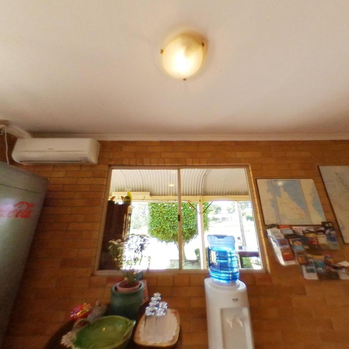 A Room With a Water Dispenser and a Window — Country Comfort Gin Gin Wild Scotsman Motor Inn in Gin Gin, QLD