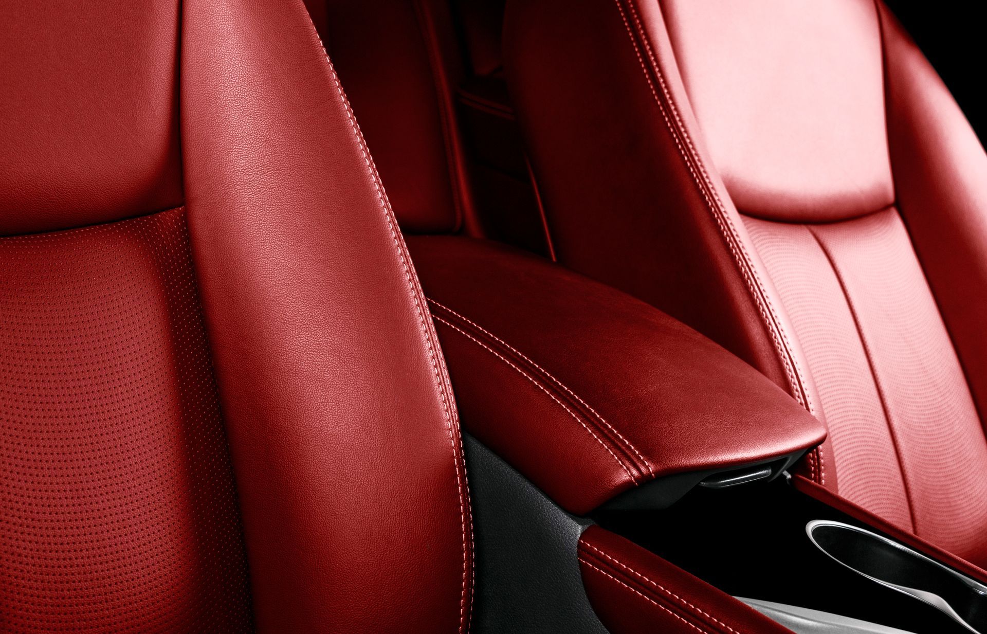 A close up of a red leather car seat