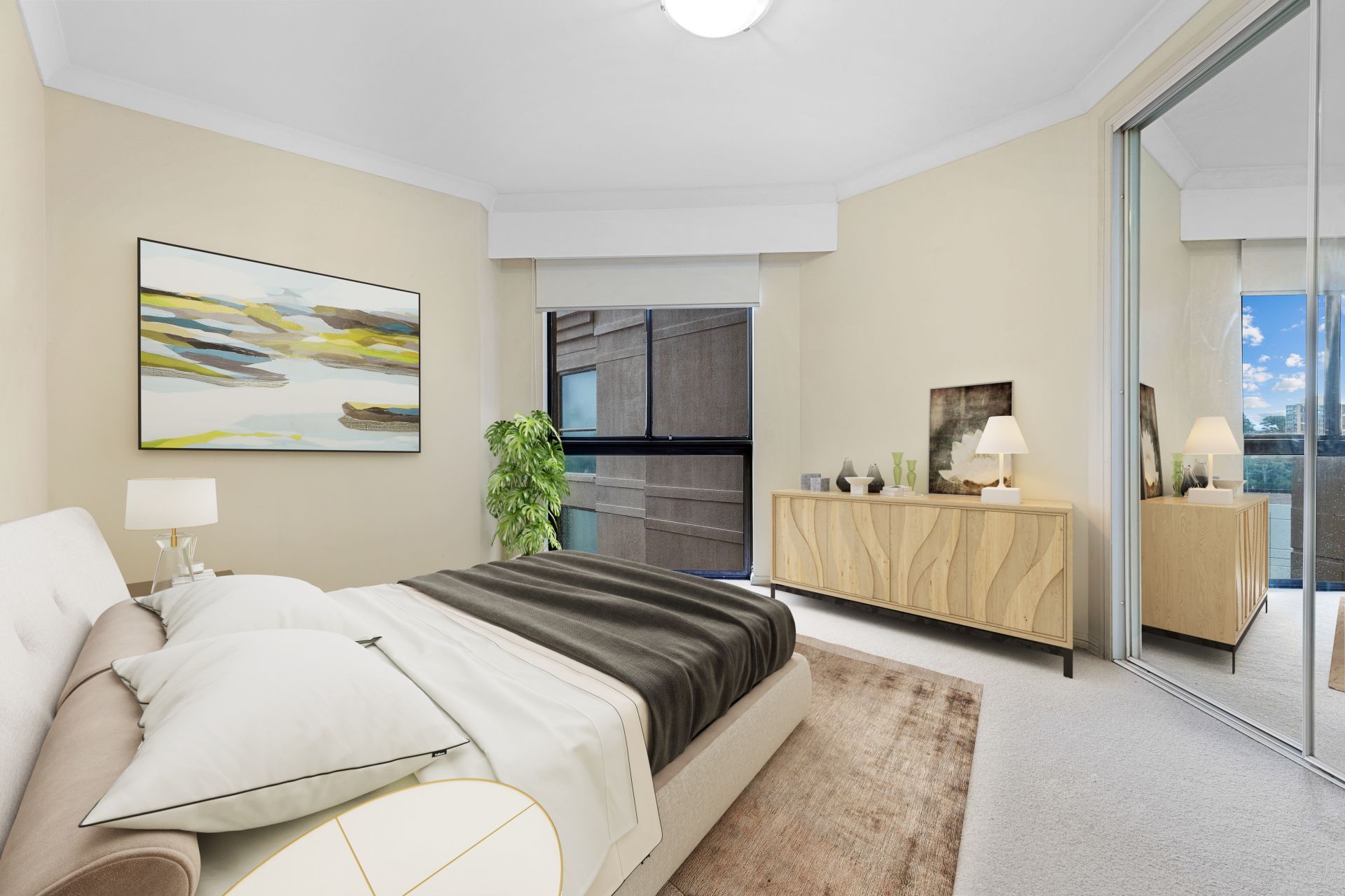 A bedroom with a large bed and a dresser