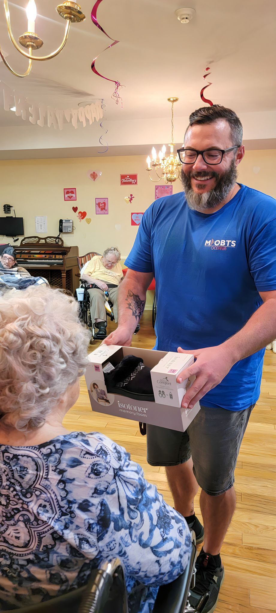 Staff member during a resident activity at Newburgh Health and Rehab