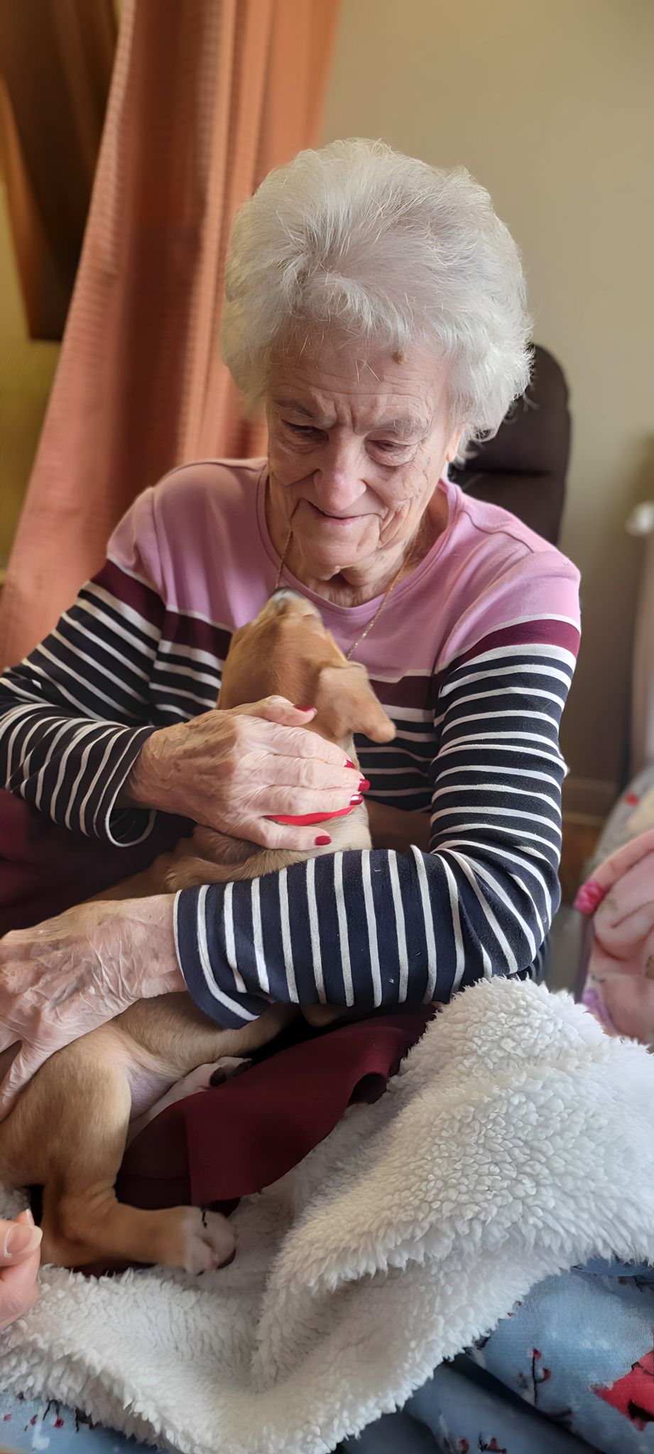 Resident seated indoors at Newburgh Health and Rehab