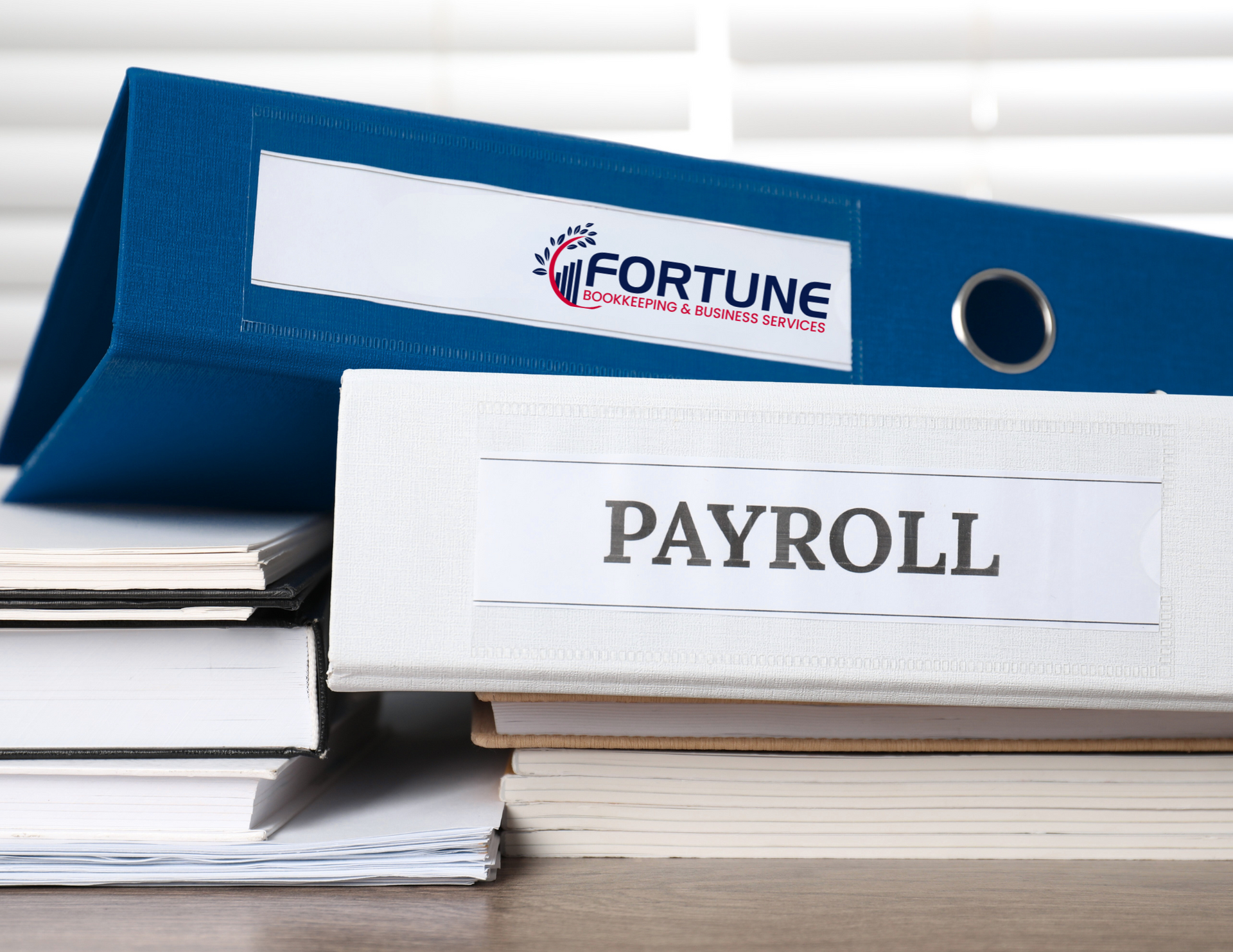 A blue binder with the word payroll on it