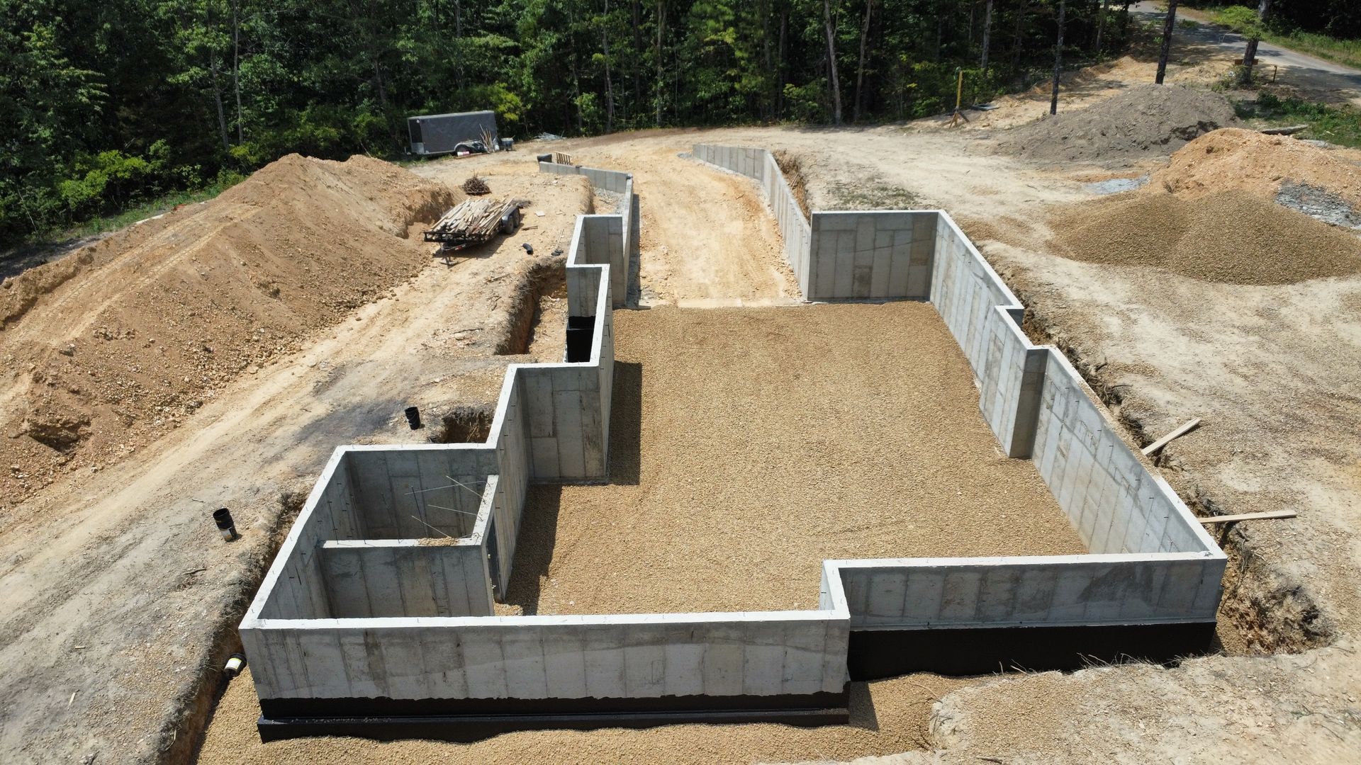 An aerial view of a concrete basement under construction.