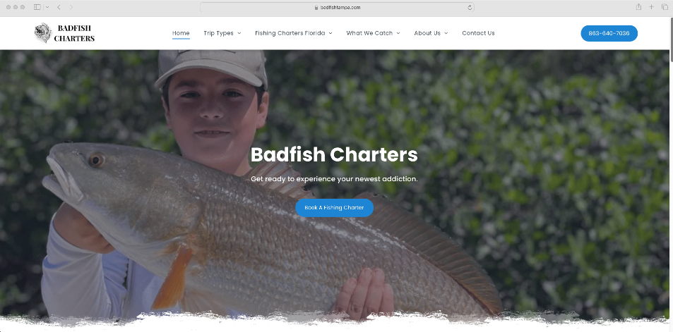 A man is holding a large fish on a website for boofish charters.