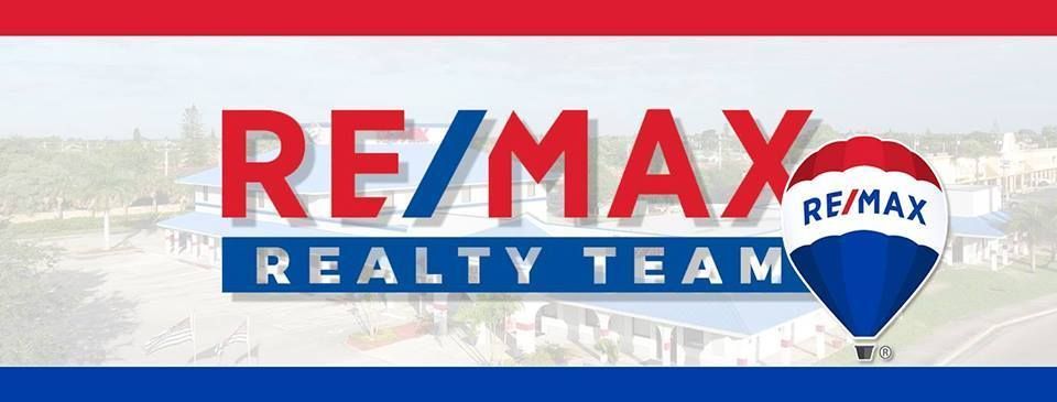 RE/MAX Realty Team logo with a hot air balloon graphic in red, white, and blue.