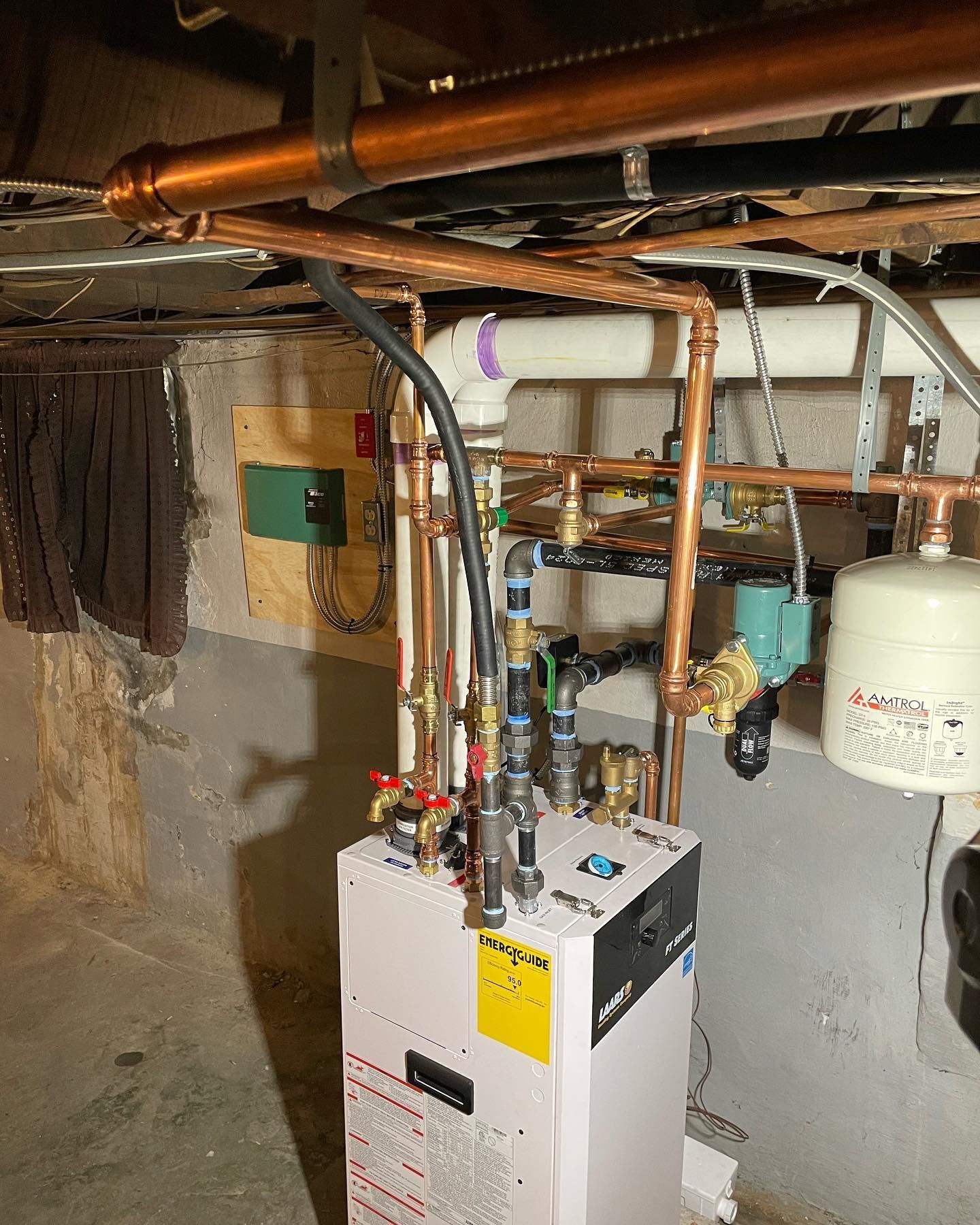 a boiler with a yellow warning label on it