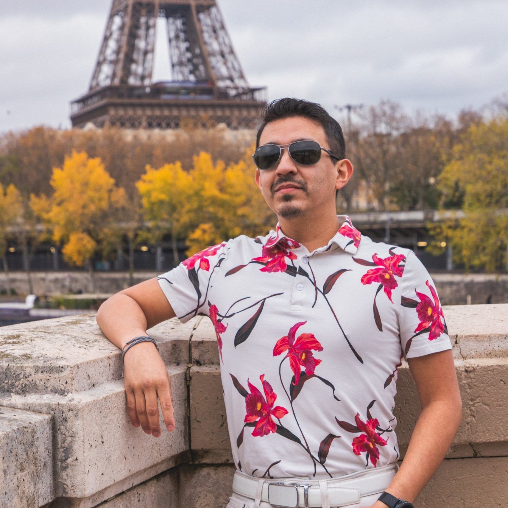 headshot of Kate Applebee with patterned shirt and grey background