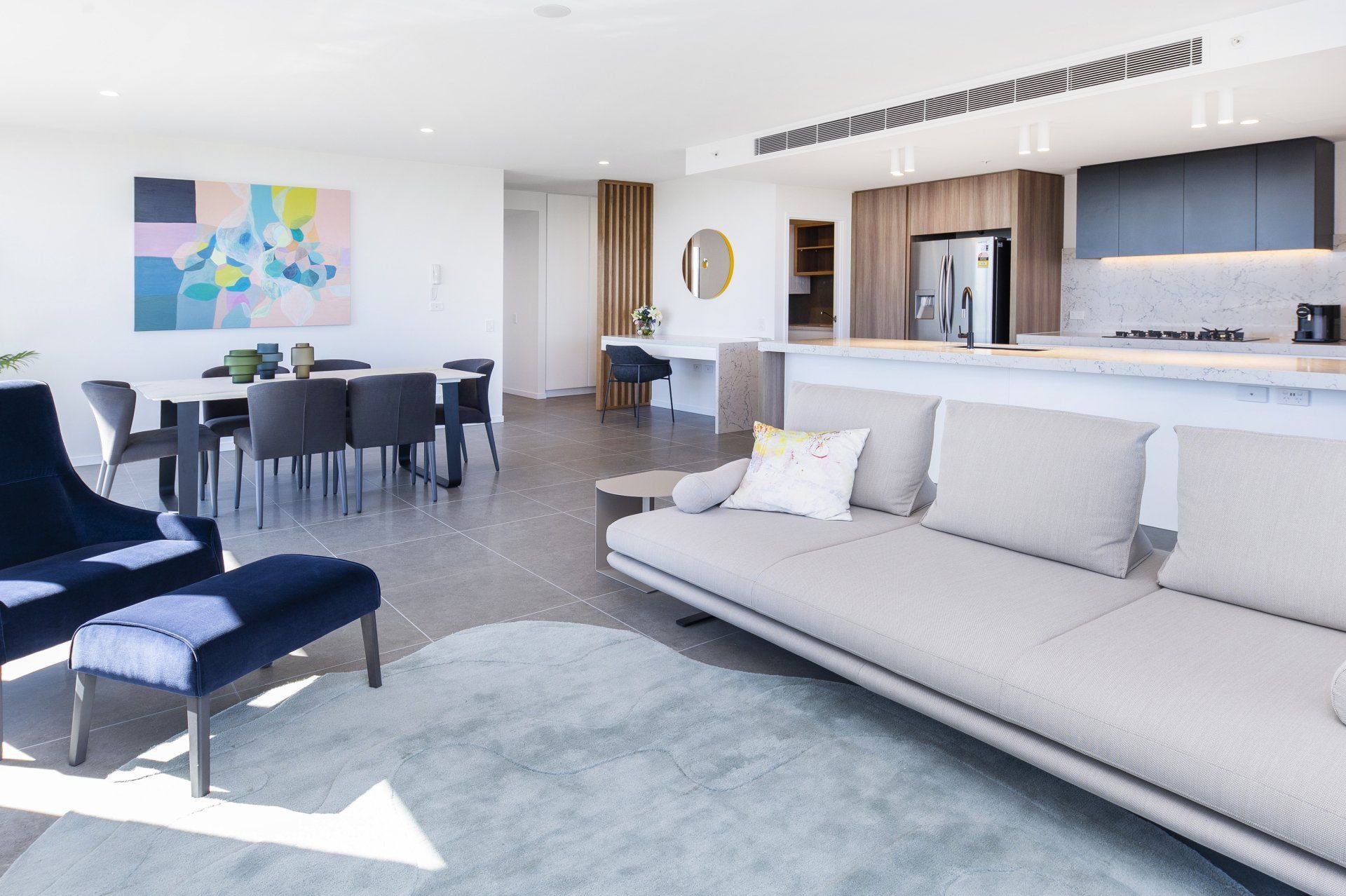 Multi Cool Pty Ltd Air Conditioning Companies Gold Coast Living Room with Girl Holding Aircon Remote