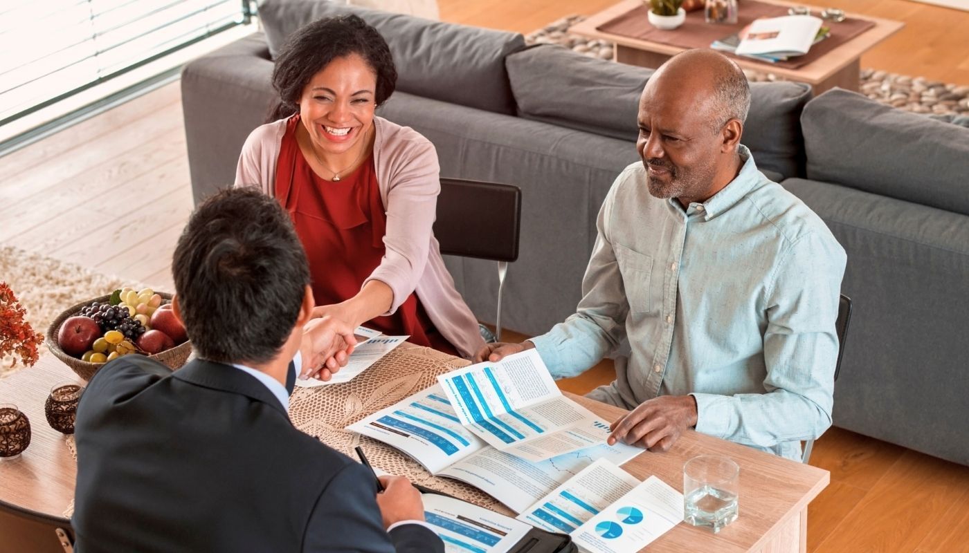 A happy couple planning retirement by investing in franchise opportunities.