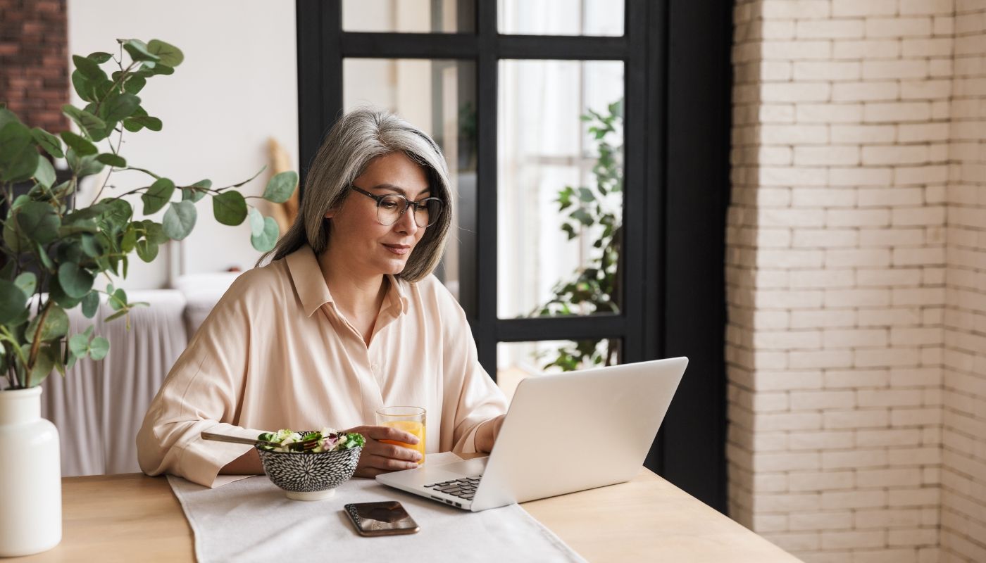 Middle-aged woman researching business ownership models