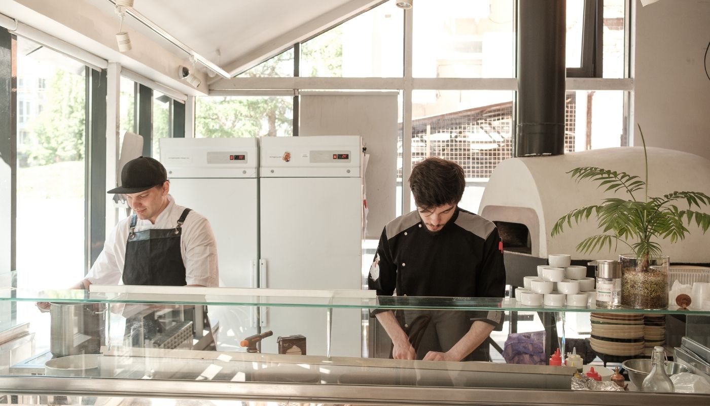 Workers in the kitchen of an eco-friendly franchise