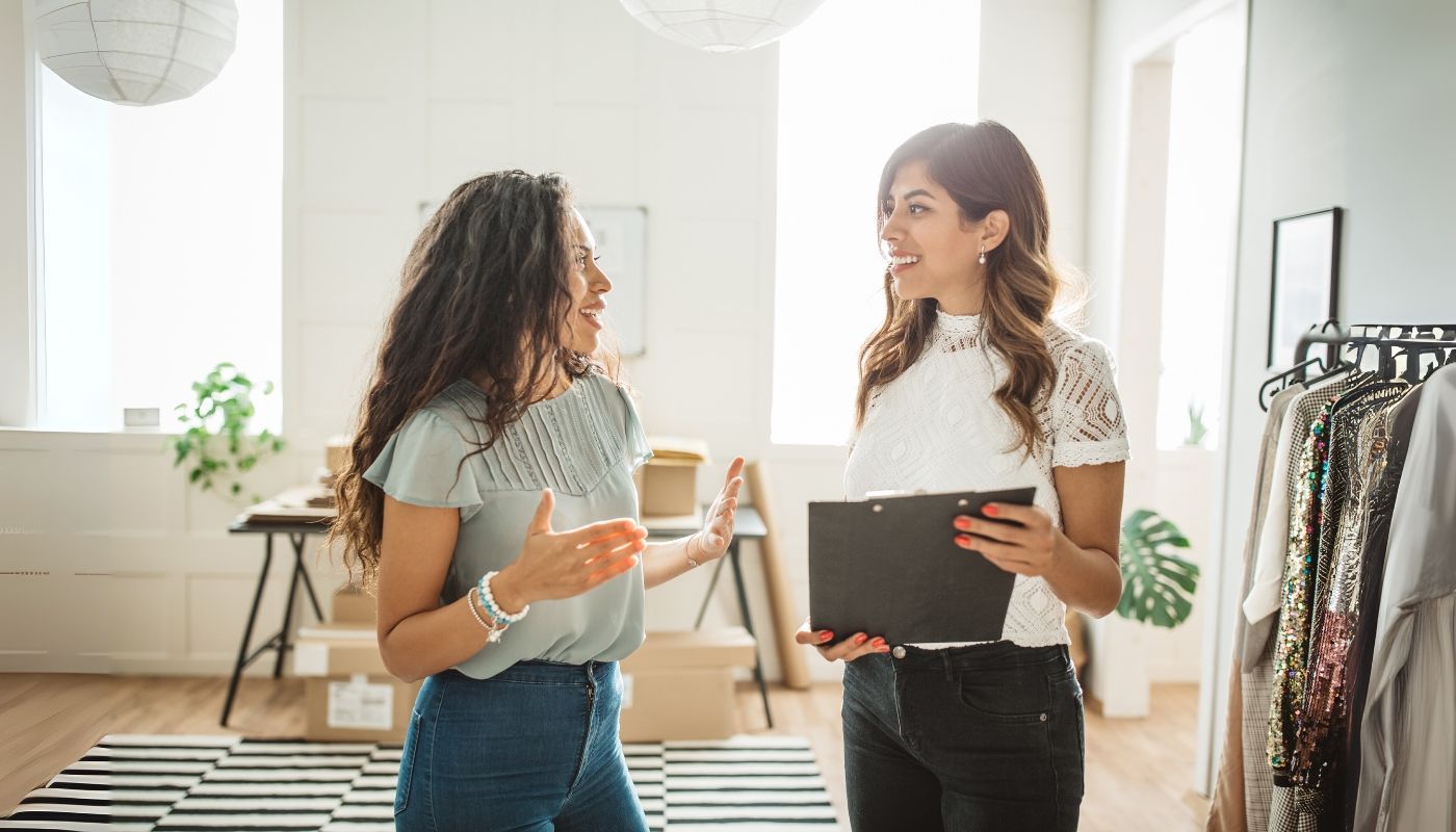 Two young ladies planning on buying a franchise business