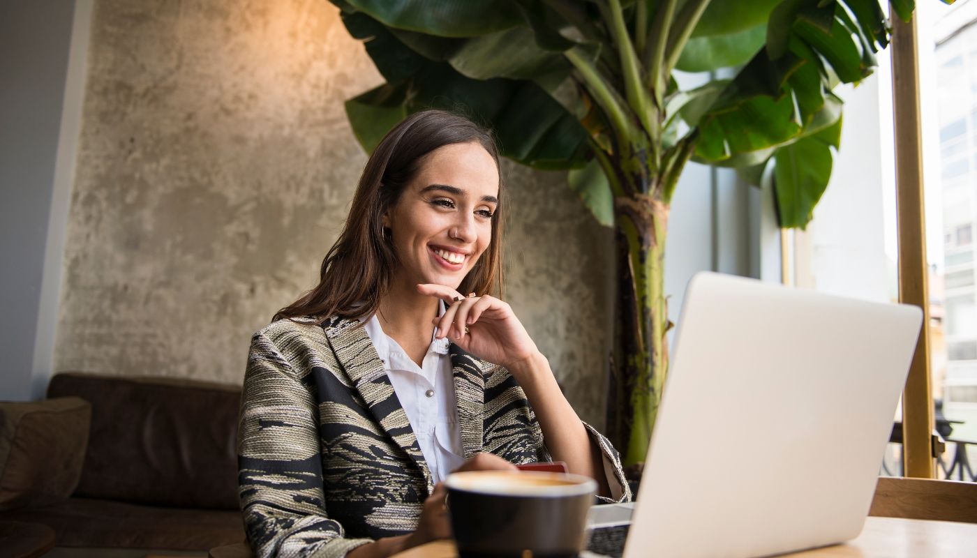 Young woman is choosing a franchise business through her laptop.