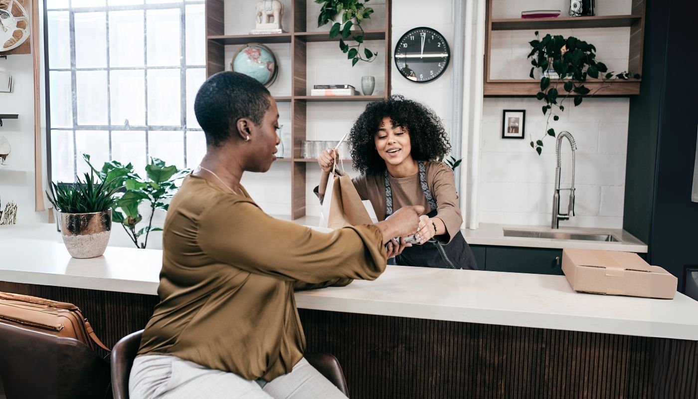Young adult woman asking how to get a franchise loan