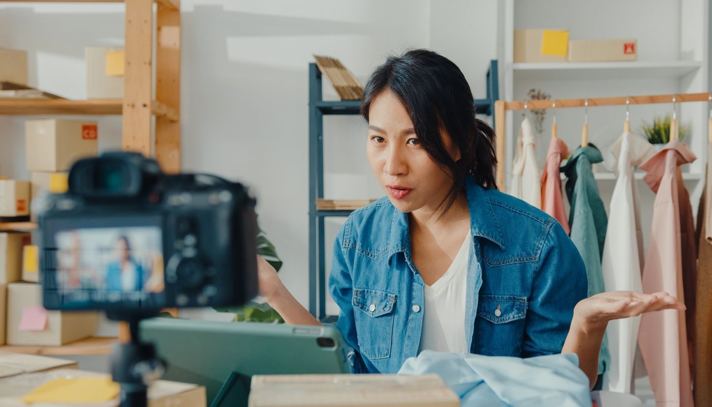 Business owner showcasing products through a livestream while demonstrating how to market your franchise