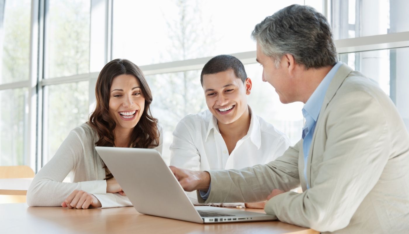 Couple getting advice from consultant on how to succeed as a franchise owner