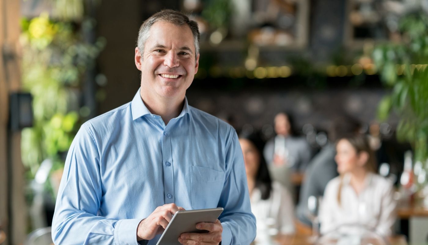 Portrait of a happy business owner representing the success and satisfaction of owning a franchise.