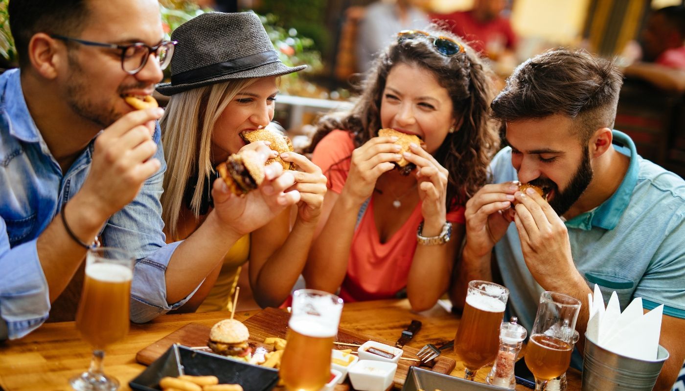 Friend group eating fast food from one of the most popular franchises to own.
