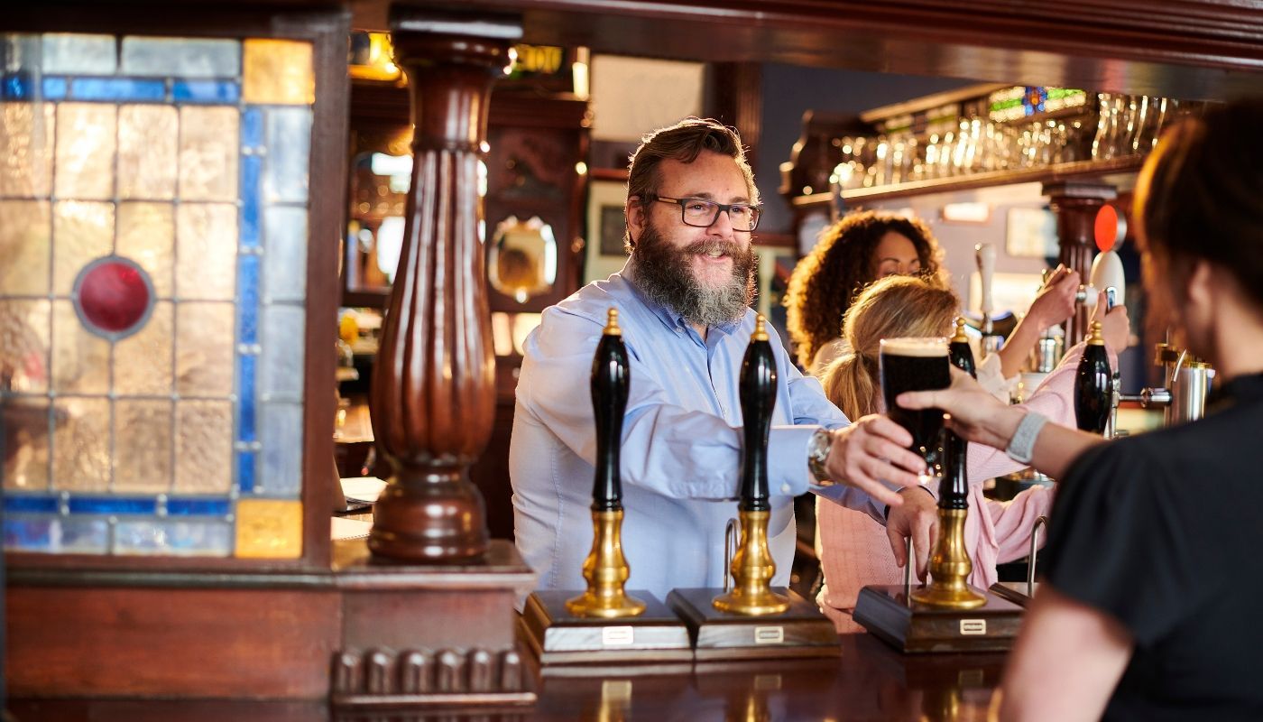 Owner of a pub franchise serving drinks
