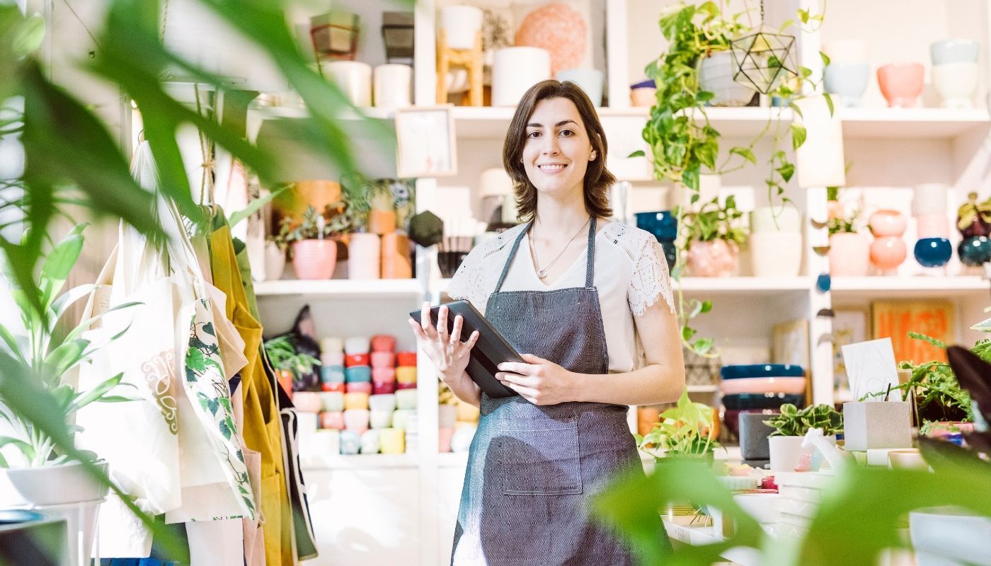 A small business owner working in a craft shop.