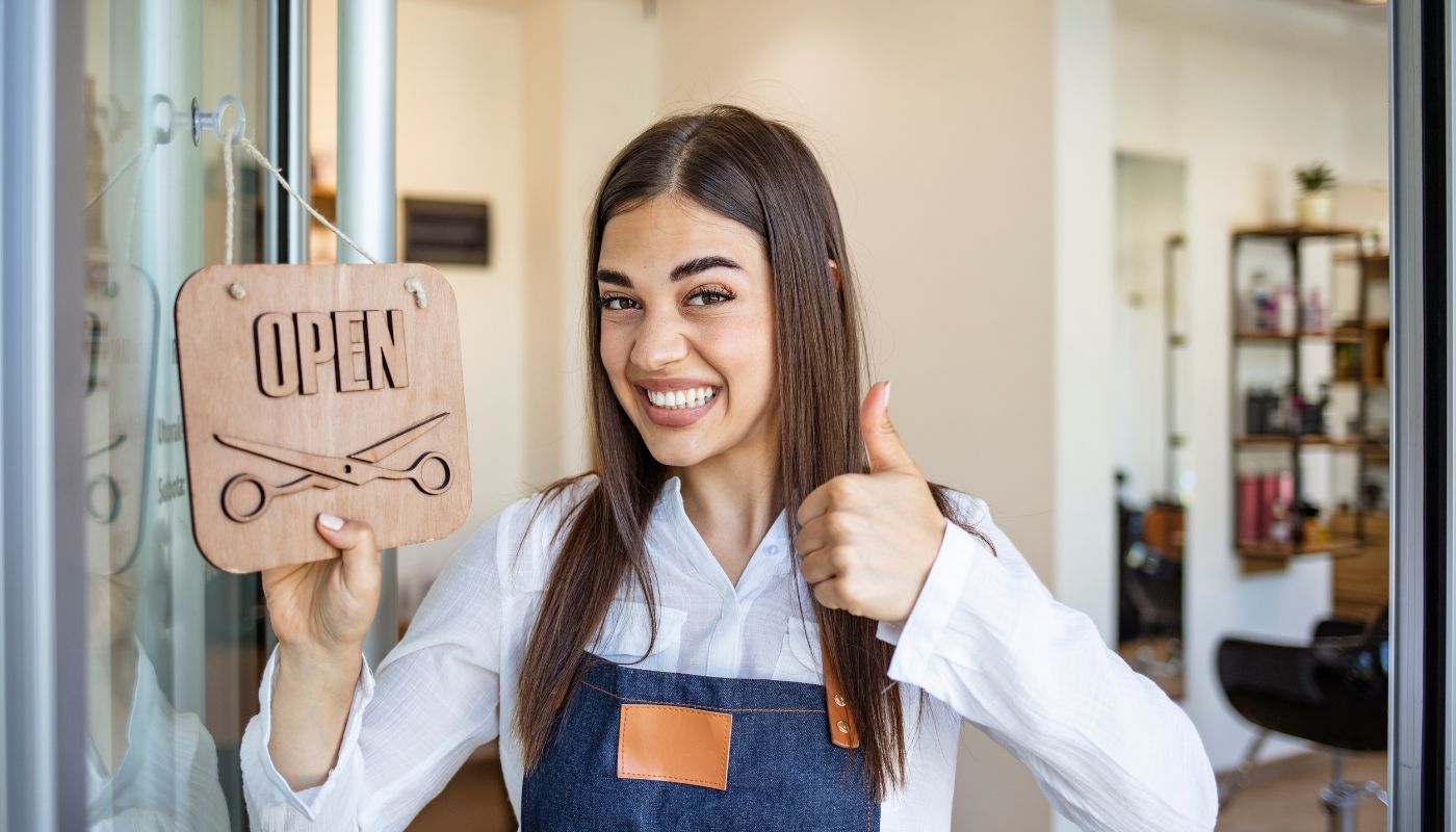 Smiling young woman starting a franchise salon business