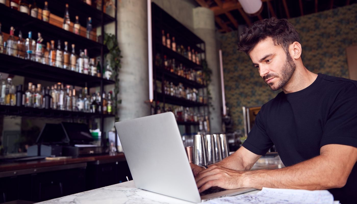 Young male business owner searching for what you need to know about franchising