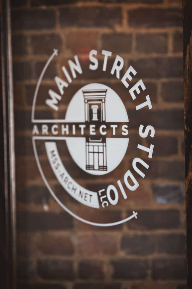 White logo on glass door: