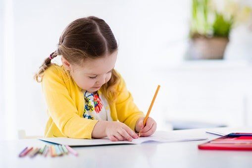 Little girl painting and writing - Child Care in Fall River, MA