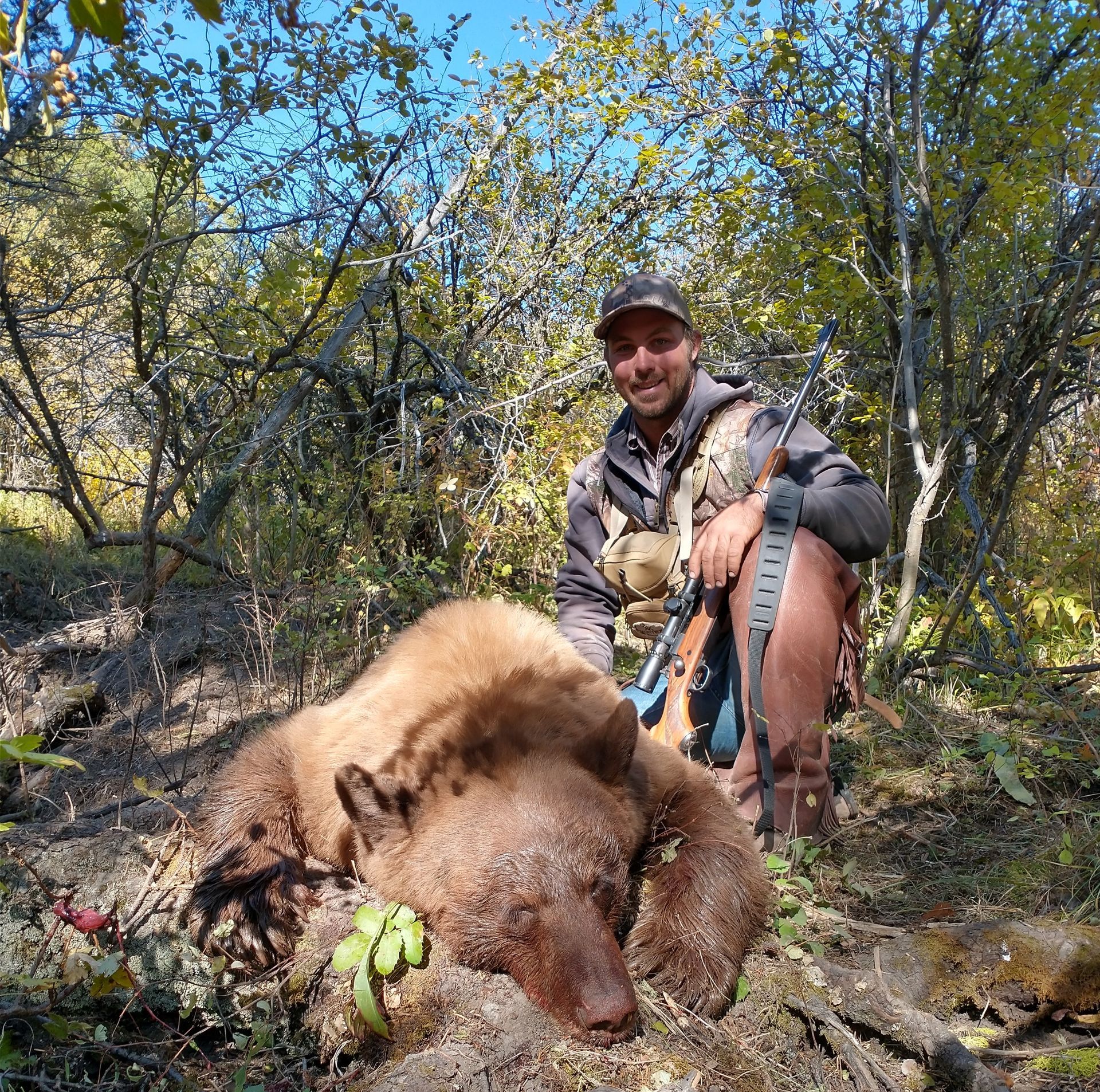 A man with a black bear.