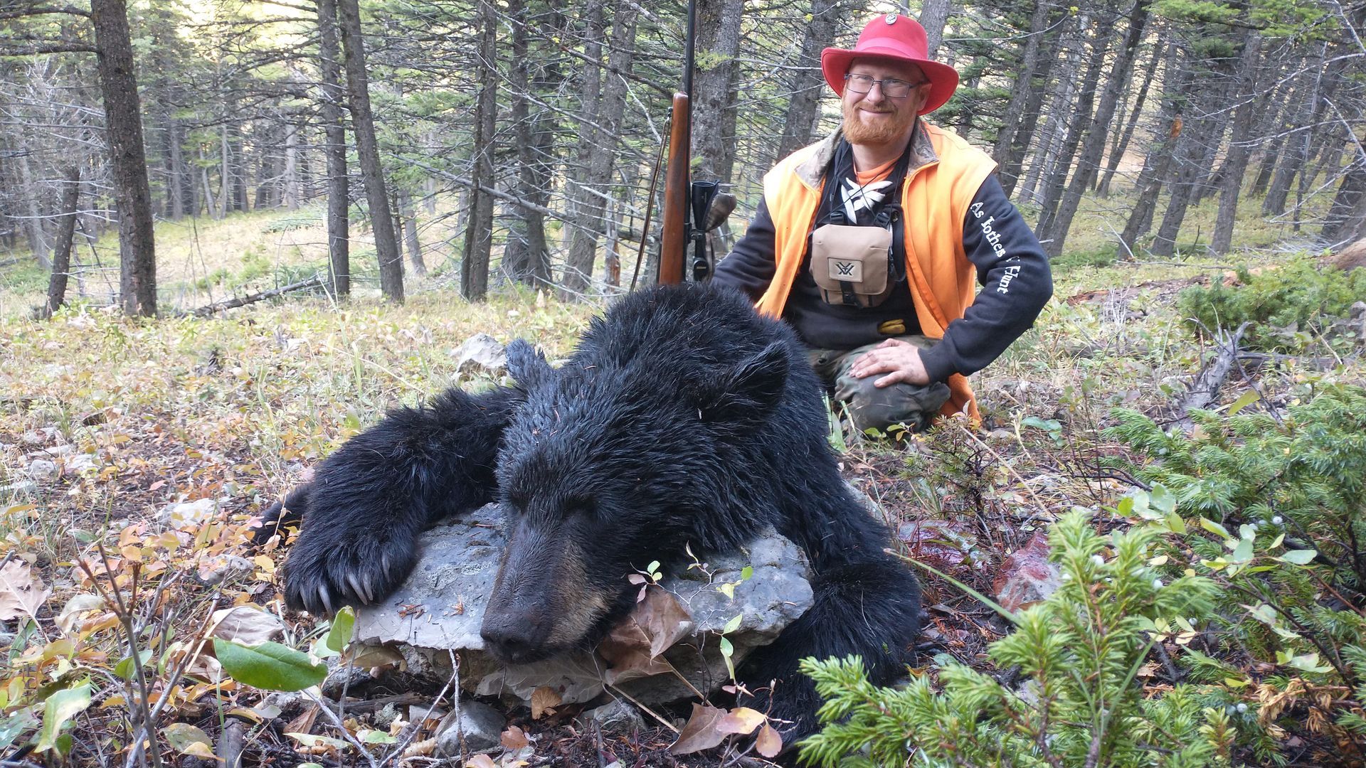 A man with a black bear.