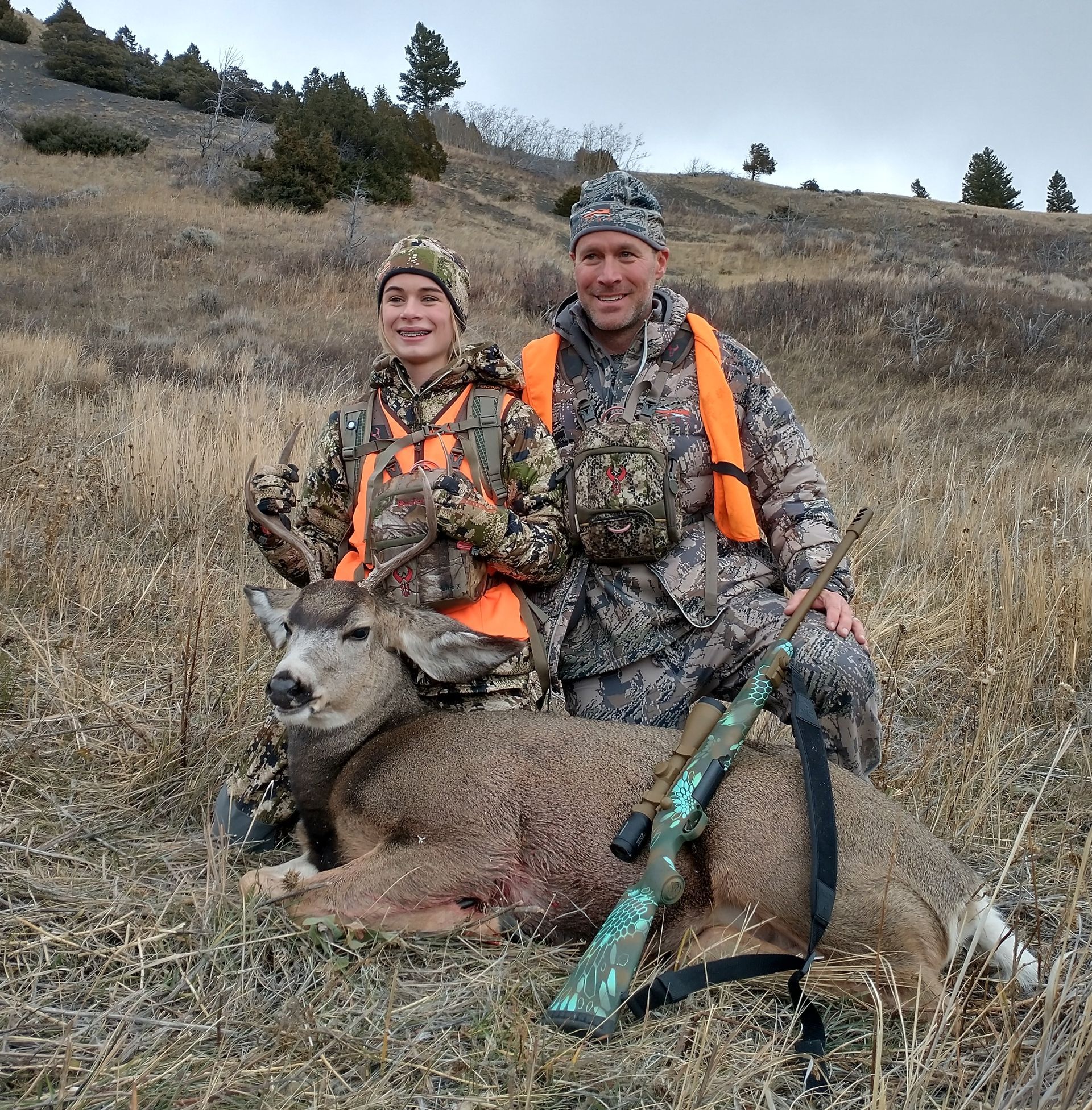 A man holding a big deer.