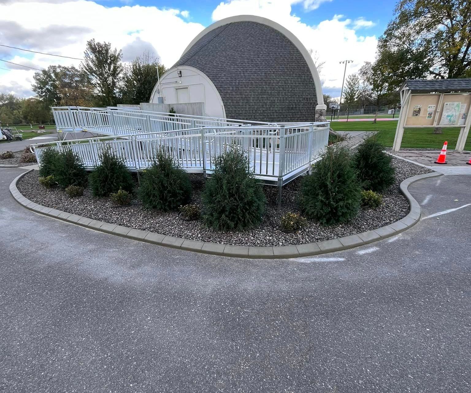 A Concrete Ramp In Front Of A Building — Cambridge, MN — Superior Companies MN A Concrete Ramp In Front Of A Building — Cambridge, MN — Superior Companies MN