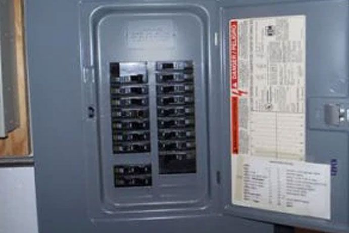 A close up of a electrical box with the door open.