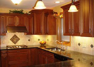 A kitchen with wooden cabinets and granite counter tops