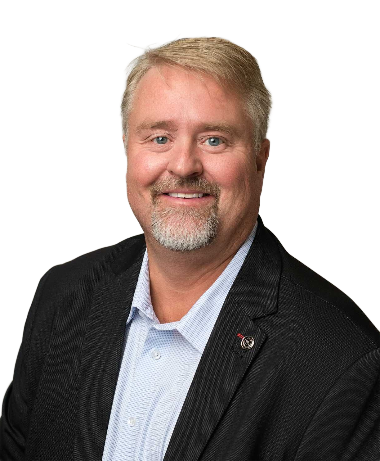 Man with a beard and graying hair, wearing a blazer and button-down shirt, smiling.