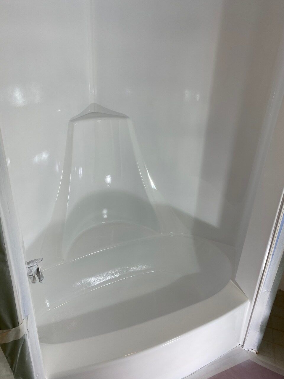 White corner shower unit.