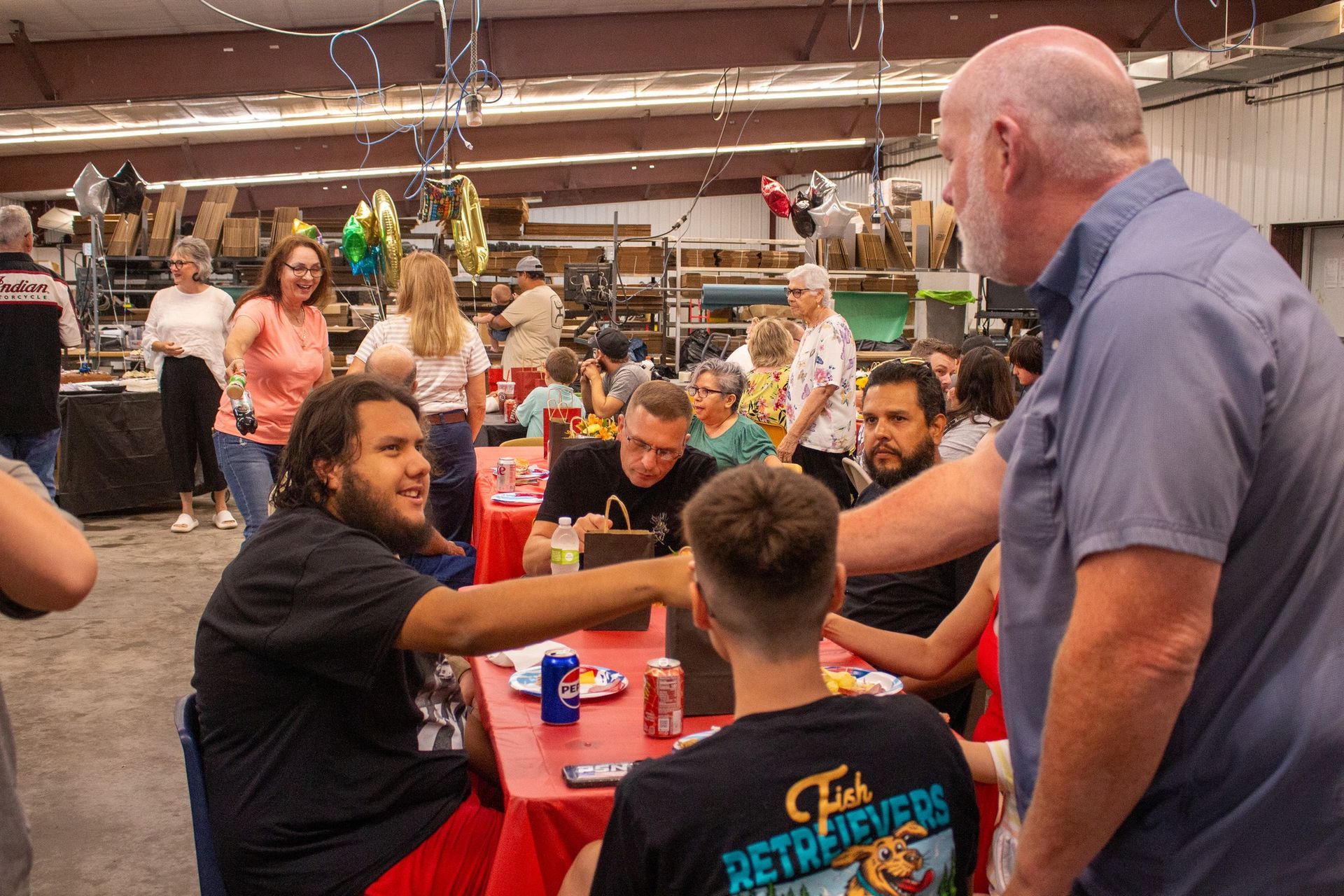 Crowd outside a building; text: 