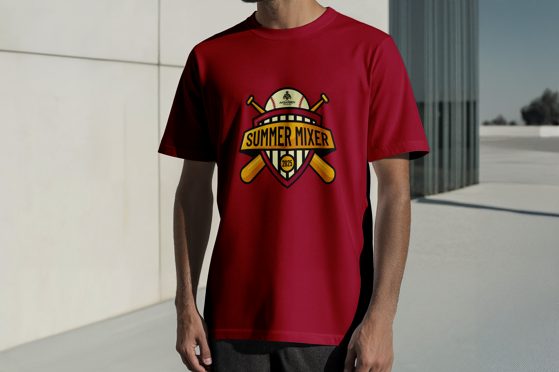 Man wearing a maroon t-shirt with a