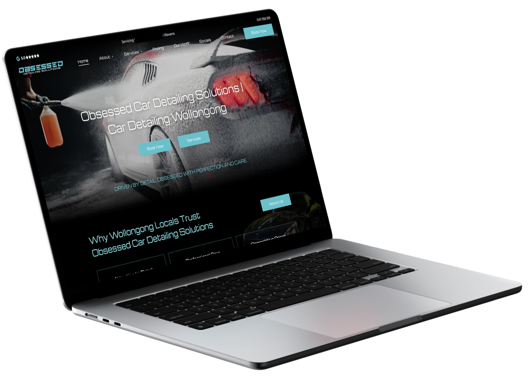 Laptop displaying a website about car detailing.