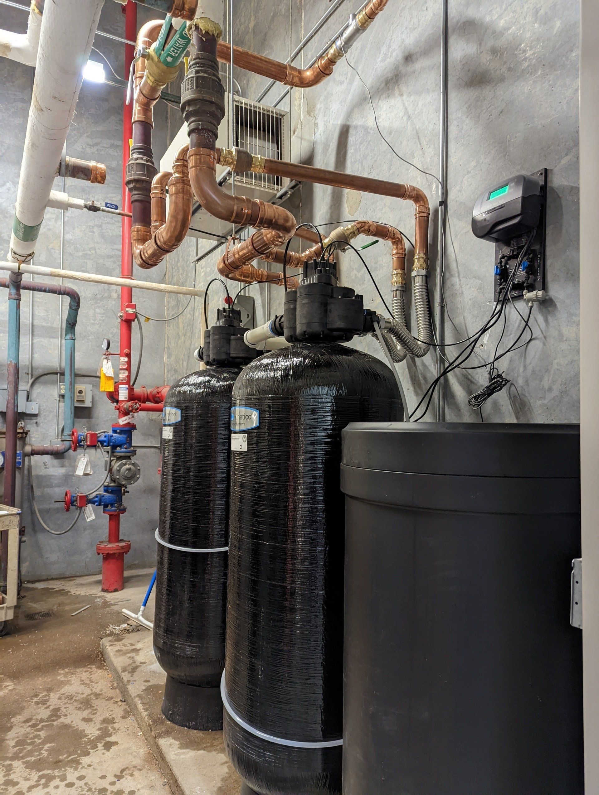 A room filled with lots of pipes and tanks.