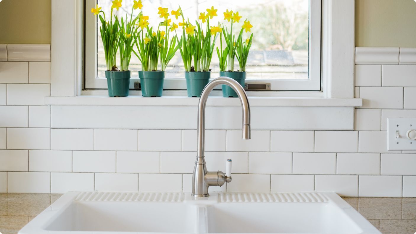 Sink with spring flowers in the background
