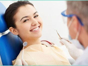 Patient with dentist — Dental Care Service in Cambridge, MN