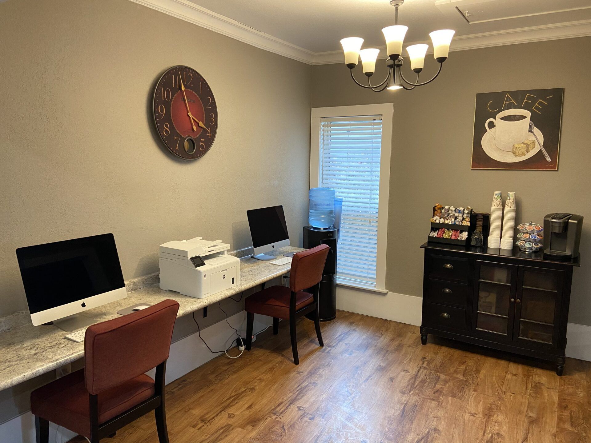 Interior of business center with imacs and coffee station to use