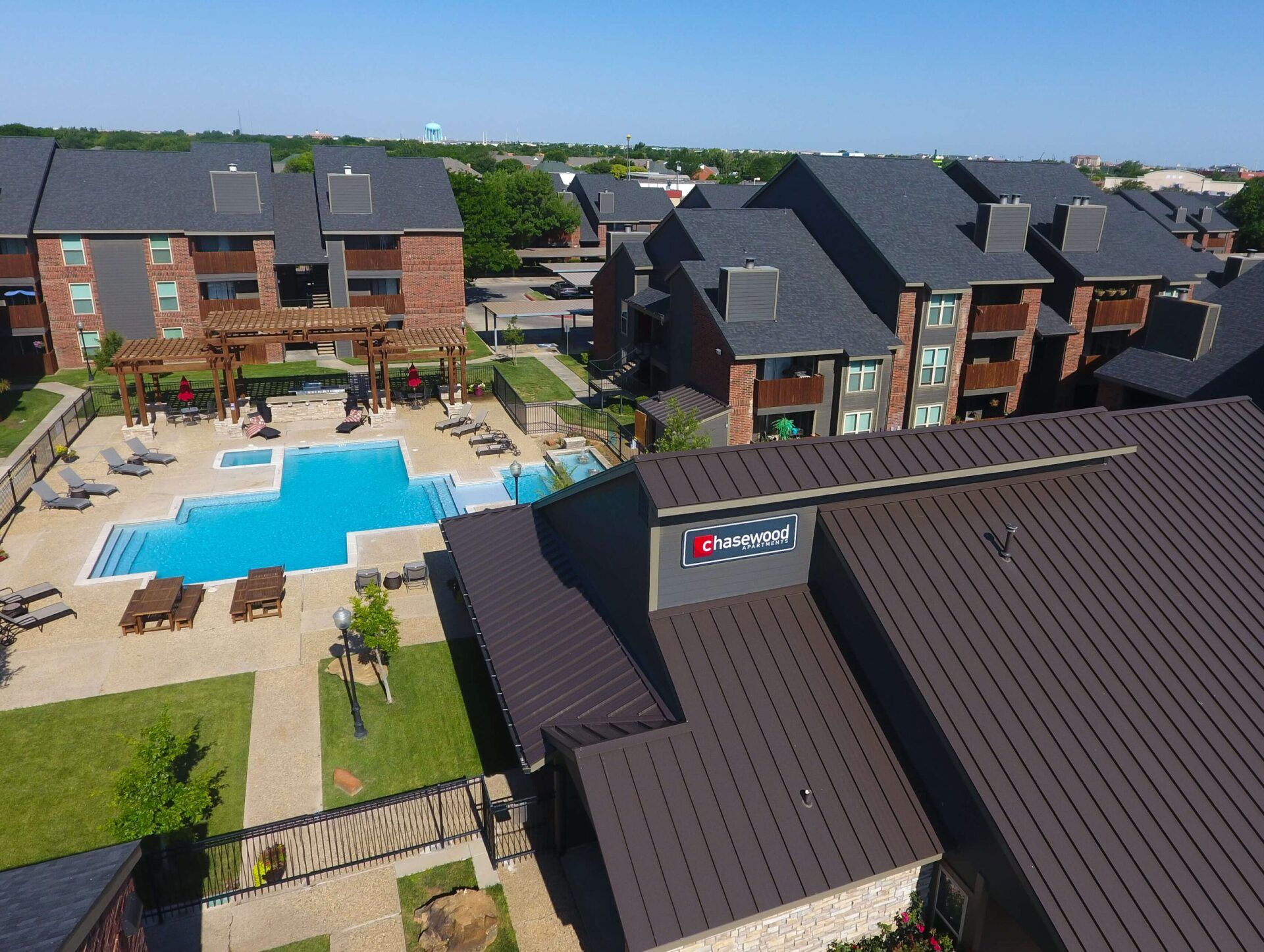 Aerial view of property with view of courtyard center with pool
