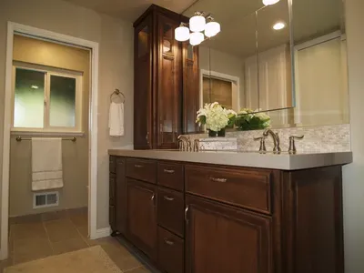 A bathroom with a double sink and a large mirror.