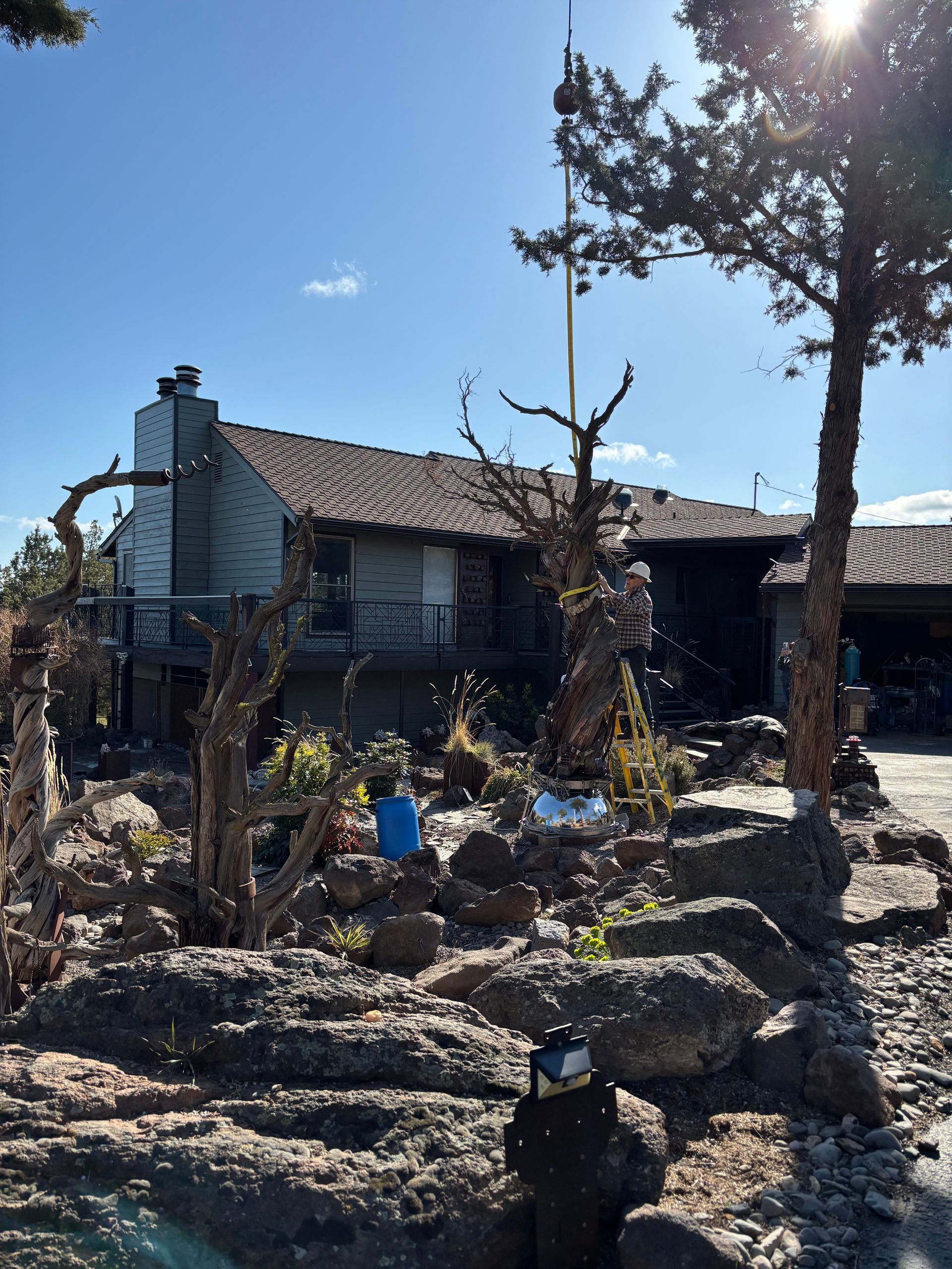 A house with a lot of rocks in front of it